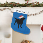 Grande Chaussette De Noël Chien de laboratoire noir avec chapeau de Noël<br><div class="desc">Cette adorable conception de chien de laboratoire noir présente une silhouette de récupérateur de labrador noir portant un chapeau santa de noël rouge et blanc. Personnalisez avec votre propre texte - votre nom, vos voeux de Noël, le nom de votre chien, etc. Cela fait un design mignon et festif pour...</div>