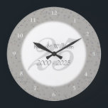 Grande Horloge Ronde 25e anniversaire Mariage de la fécule d'argent Con<br><div class="desc">25e WEDDING ANNIVERSARY SILVER STARDUST CONFETI CLOCK. Personalised with your names in faux silver over a beautiful script "25" (or a monogram initial),  on a delicate silver stardust confeti background. Designed by Pure Piglet © at www.zazzle.com/purepiglet*</div>