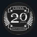 Grande Horloge Ronde China Traditional wedding anniversary 20 years<br><div class="desc">A design to celebrate 20 years of marriage. This design has a white (china) colored laurel design on a black background. China is the traditional gift for this occasion. The text reads china 20 years anniversary. A romantic design to celebrate your 20th year of marriage. If you would like any...</div>