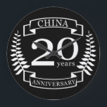Grande Horloge Ronde China Traditional wedding anniversary 20 years<br><div class="desc">A design to celebrate 20 years of marriage. This design has a white (china) colored laurel design on a black background. China is the traditional gift for this occasion. The text reads china 20 years anniversary. A romantic design to celebrate your 20th year of marriage. If you would like any...</div>