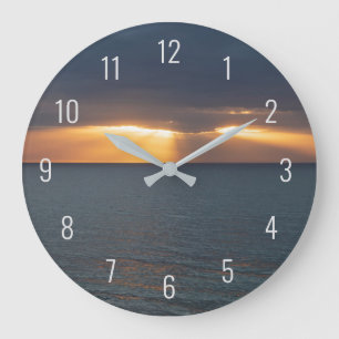 Grande Horloge Ronde Coucher de soleil sur l'océan en traversant les nu