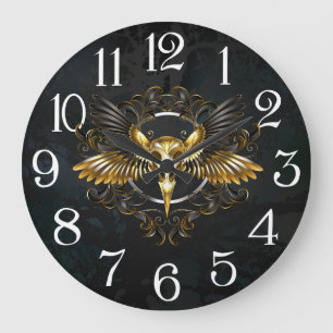 Grande Horloge Ronde Crâne d'oiseaux dorés sur arrière - plan noir