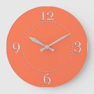 Grande Horloge Ronde Décor couleur corail saumon sur un
