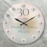 Grande Horloge Ronde Elegant Script Pearl 30th Wedding Anniversary<br><div class="desc">Featuring beautiful pearls,  this chic 30th wedding anniversary clock can be personalized with your special pearl anniversary information on a pearl background. Designed by Thisisnotme©</div>