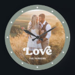 Grande Horloge Ronde Love (homonymie) | Script moderne with Photo Sage<br><div class="desc">This colorful and stylish clock feyour favorite personal family photo,  with trendy white typographiy and a spot to add your name. The Border of the clock is a sage green color.</div>