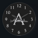 Grande Horloge Ronde Noir Argent moderne Script Girl Monogramme Nom<br><div class="desc">Horloge de nom de monogramme simple en noir et argent. Cela rend le cadeau parfait pour 16 ans,  mariage,  douche nuptiale,  anniversaire,  baby shower ou bachelorette pour quelqu'un qui aime le luxe glam et les styles chic.</div>