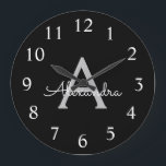 Grande Horloge Ronde Noir Argent moderne Script Girl Monogramme Nom<br><div class="desc">Horloge de nom de monogramme simple en noir et argent. Cela rend le cadeau parfait pour 16 ans,  mariage,  douche nuptiale,  anniversaire,  baby shower ou bachelorette pour quelqu'un qui aime le luxe glam et les styles chic.</div>