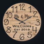 Grande Horloge Ronde Rustic Personalized Brown Wood Custom<br><div class="desc">Beautiful, unique, one-of-a-kind personalized design features a faux-rustic brown wood with black personalization his and her names in a script font overlay design and the last name and year established in a bold script with a printed wood effect background. Personalize this clock by adding your personal information. Makes a great...</div>