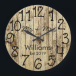Grande Horloge Ronde Rustic Personalized Brown Wood Custom<br><div class="desc">Beautiful, unique, one-of-a-kind personalized design features a faux-rustic brown wood with black personalization his and her names in a script font overlay design and the last name and year established in a bold script with a printed wood effect background. Personalize this clock by adding your personal information. Makes a great...</div>