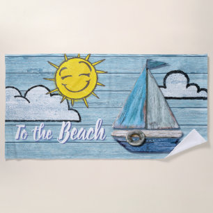 Grande serviette de plage à la plage