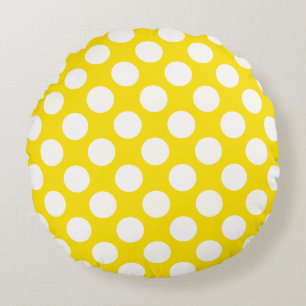Grands pois blancs sur un coussin jeté jaune