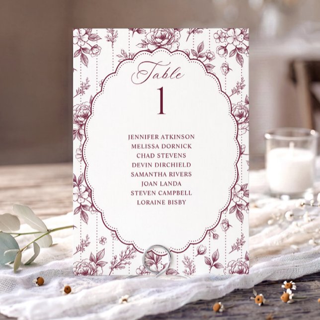 Graphique de placement de mariage rouge vin floral (Dark wine red French floral seating chart card with oval scalloped frame.)