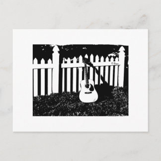 Guitare acoustique et carte postale de clôture