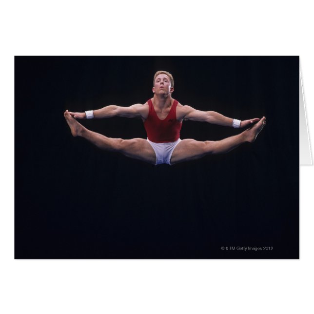 Gymnaste masculin se produisant sur le sol exercic (Devant horizontal)