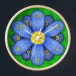 Horloge Blue Daisy Flower on Green Beautiful<br><div class="desc">This pretty floral clock has sur stylized flower on it, in a daisy style and colored blue. The yellow-orange clock numbers mark the time on the twelve petals. The background is done in abstract mottled green, resembling grass. This is a bright, bold clock for a gardener or any lover of...</div>
