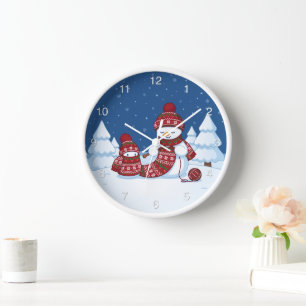 Horloge Bonhomme de neige tricotant une écharpe de Noël