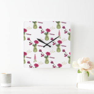 Horloge Carrée Arrangement exotique de fleurs dans le verre