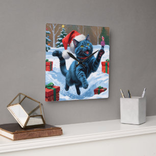 Horloge Carrée Chat Bleu Russe Courant dans la Neige avec un Chap