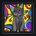 Horloge Carrée Chat d'art pop noir<br><div class="desc">Horloge murale amusante et colorée,  avec des dessins animés comme des graphiques d'un chat noir style pop art. Idée cadeau pour n'importe quel amoureux des chats.</div>