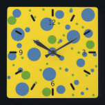 Horloge Carrée Clock Green and Blue Spotted Wall<br><div class="desc">What fun design for a clock ! Yellow background with blue and green spots scattered all about. C'est rétro, c'est hip, c'est colorful, c'est trendy, et c'est parfait pour a teen's room, a dorm room, a kitchen, or a family room. This clock would make in unforgettable housewarming or boatwarming (or...</div>