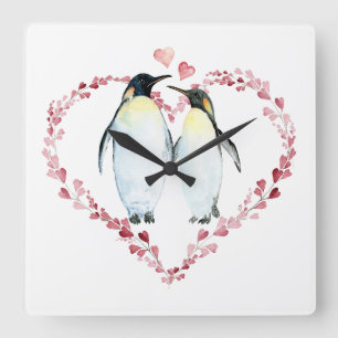 Horloge Carrée Couple de pingouin dans le coeur amoureux Wreath