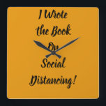 Horloge Carrée Écrit le livre sur la détresse sociale<br><div class="desc">slogan sarcastique sur la distance sociale et les vêtements de quarantaine. Apportez ceci à votre prochaine fête pour un amusant sarcasme ou un décor de maison amusant</div>