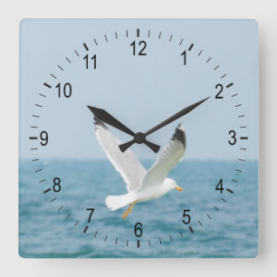 Horloge Carrée Goéland volant au-dessus de la mer