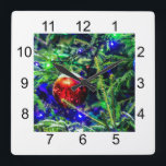 Horloge Carrée Green Christmas Tree Red Ball<br><div class="desc">Green Christmas tree,  blue decorative lights and red ornament ball covered with fresh snow. Cheerful and joyful mood. Merry Christmas and Happy New Year. Prints and gifts for anyone for fun and good mood. Square format products and souvenirs.</div>