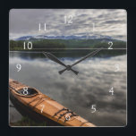 Horloge Carrée Kayak en bois sur la rive du lac Beaver<br><div class="desc">Chuck Haney / DanitaDelimont.com | USA,  Amérique du Nord,  Montana | Kayak en bois sur la rive du lac Beaver près de Whitefish,  Montana,  USA.</div>