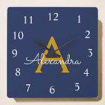 Horloge Carrée Marine Blue Gold Script Monogramme Nom de la fille<br><div class="desc">Monographie de script bleu or et marine Monogramme Nom Horloge. Cela rend le cadeau parfait pour 16 ans,  mariage,  douche nuptiale,  anniversaire,  baby shower ou bachelorette pour quelqu'un qui aime le luxe glam et les styles chic.</div>