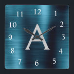 Horloge Carrée Monogramme métallique élégant bleu moderne Nom<br><div class="desc">Monogramme d'huile d'acier inoxydable moderne et élégant Blue Faux Nom et horloge murale personnalisée initiale. L'horloge murale est le cadeau parfait pour quelqu'un qui aime la décoration métallique chic branchée à donner comme cadeau de Noël ou d'anniversaire.</div>