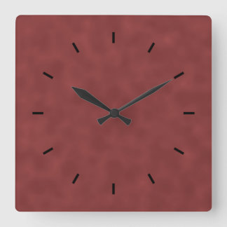 Horloge Carrée Motif Arrière - plan dans les tons rouge foncé.