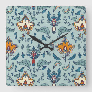 Horloge Carrée Motif floral orné sur fond bleu pâle