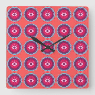 Horloge Carrée Motif oculaire coloré sur Arrière - plan rouge