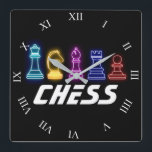 Horloge Carrée Neon Lights Pièces d'échecs Échecs Reine<br><div class="desc">Cette superbe horloge thématique Échecs comporte une série de pièces d'échecs pour inclure,  dans l'ordre de gauche à droite,  la Reine,  chevalier,  évêque,  rook et un pion. Sous les pièces lumineuses du néon se trouve le mot Échecs dans une police futuriste.</div>