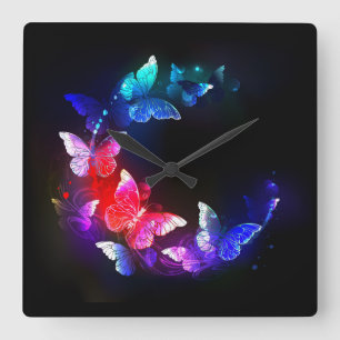 Horloge Carrée Papillons de nuit néon lumineux sur fond noir