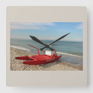 Horloge Carrée Pattino rosso sulla spiaggia - ricordi di mare