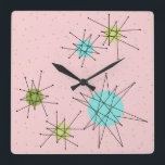 Horloge Carrée Pink Iconic Atomic Starburst Wall Clock<br><div class="desc">This Pink Iconic Atomic Starburst Square Acrylic Wall Clock pattern feels iconic atomic starbursts. That's right ! La vieille école, la première dame rose colorée, with gold speckles is the perfect backdrop for the vibrant turquoise, soothing celery, and kitschy pear green colored circles. Les spots of color are sporadically placed...</div>