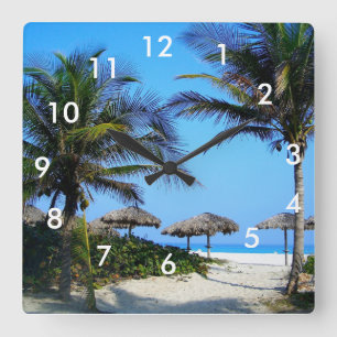 Horloge Carrée Plage de sable avec palmiers et vue sur l'océan Sq