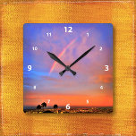 Horloge Carrée Rainbow orange coucher de soleil ciel paysage phot<br><div class="desc">Appréciez la beauté de la nature chaque fois que vous regardez l'heure sur cette horloge murale photographique d'un arc-en-ciel niché dans un coucher de soleil bleu, rose et orange doux. Vous avez le choix entre un visage rond ou carré. Fait un grand cadeau de ménage! Vous pouvez facilement personnaliser cette...</div>