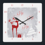 Horloge Carrée Red and Gray Ho Ho Ho Christmas Clock with Deer<br><div class="desc">This consolive red, grey, and white "Ho Ho" clock has a deer with antlers adorned with holly and berries, a red gift with ribbons, snowflakes, stars, and a variety of Christmas trees on foggy gray winter background with a snowy border on it. It would make a lovely addition to your...</div>