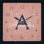 Horloge Carrée Rose Gold Sparkle Glitter Monogram<br><div class="desc">Blush Pink - Rose Gold and Navy Blue Sparkle Glitter Monogram Name and Initial Serving Wall Clock. The Wall Clock makes the perfect gift for someone who loves pink glitter.</div>