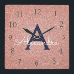 Horloge Carrée Rose Gold Sparkle Glitter Monogram<br><div class="desc">Blush Pink - Rose Gold and Navy Blue Sparkle Glitter Monogram Name and Initial Serving Wall Clock. The Wall Clock makes the perfect gift for someone who loves pink glitter.</div>
