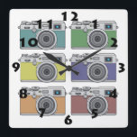 HORLOGE CARRÉE SIX CAMÉRAS PHOTOS VINTAGES DANS LE STYLE POP ART<br><div class="desc">Une horloge blanche très élégante dans le style Pop Art,  avec des chiffres noirs,  et une illustration numérique de six appareils photo rétro colorés. Cette horloge murale insolite est personnalisable et est disponible dans d'autres options. Visitez notre magasin pour des cadeaux plus créatifs !</div>
