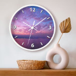 Horloge Coucher de soleil violet océan nuages photo modern<br><div class="desc">S'inspirer chaque fois que vous regardez l'heure sur cette horloge murale photographique d'un magnifique coucher de soleil mauve, rose et bleu, à la lumière douce sur l'océan Pacifique. Vous avez le choix entre un visage rond ou carré. Fait un grand cadeau de ménage! Vous pouvez facilement personnaliser cette horloge murale....</div>