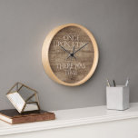 Horloge Élégant Devis Sur Le Motif Faux Wood Grain<br><div class="desc">Vintage élégant One Upon A Time Il y avait Time citation texte sur un faux arrière - plan en bois de couleur marron écrit dans une police de script de calligraphie très élégante. Classic rétro chic, élégant mais simple design de base pour la décoration de maison artistique concepteur de mode,...</div>