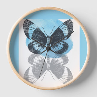 Horloge La magie des papillons bleus.