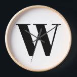 Horloge Lettre initiale de monogramme noir<br><div class="desc">Monogramme personnalisé moderne typographie de lettre initiale élégant mur Horloge. Texte noir personnalisé,  arrière - plan blanc. Disponible sous différentes formes (rondes ou carrés) tailles et matériaux</div>