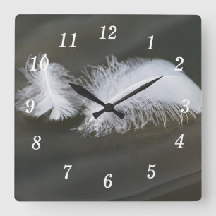 Horloge murale des plumes d'oie flottantes