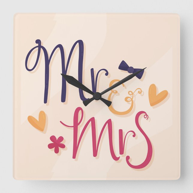 Horloge murale en acrylique M. et Mme (Square wall clock with the words "Mr. & Mrs" in a playful, cartoonish font.)